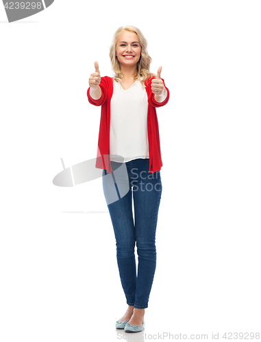 Image of happy smiling young woman showing thumbs up