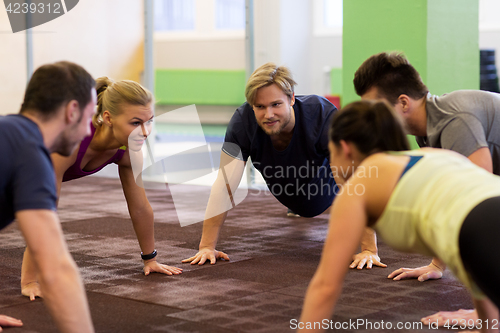 Image of group of people exercising in gym