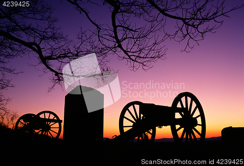 Image of War Memorial Wheeled Cannon Military Civil War Weapon Dusk Sunse