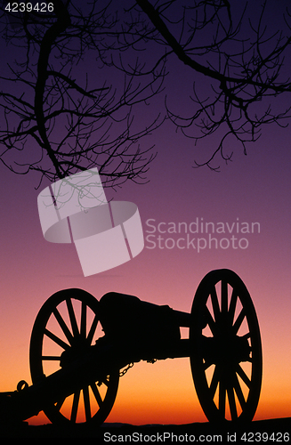 Image of War Memorial Wheeled Cannon Military Civil War Weapon Dusk Sunse