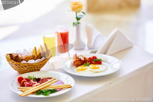 Image of delicious breakfast for two at the luxury hotel.