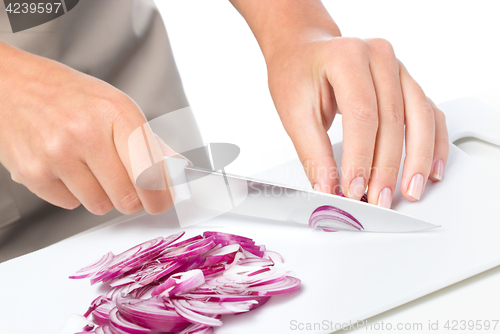 Image of Cook is chopping onion