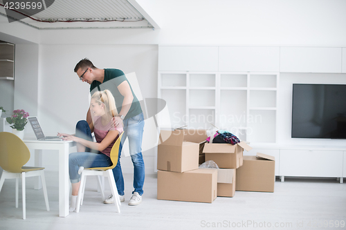 Image of Young couple moving in a new home