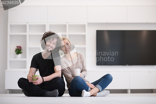 Image of young couple in their new home