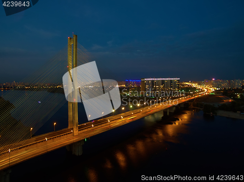 Image of Automobile and railroad bridge in Kiev, the capital of Ukraine. Bridge at sunset across the Dnieper River. Kiev bridge against the backdrop of a beautiful sunset in Kiev. Bridge in evening sunshine