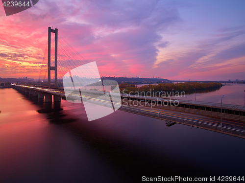 Image of Automobile and railroad bridge in Kiev, the capital of Ukraine. Bridge at sunset across the Dnieper River. Kiev bridge against the backdrop of a beautiful sunset in Kiev. Bridge in evening sunshine