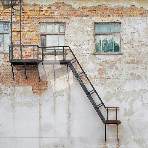 Image of metal staircase attached to the wall