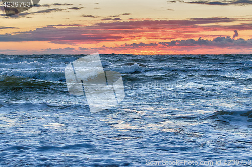 Image of Sunset At The Stormy Sea