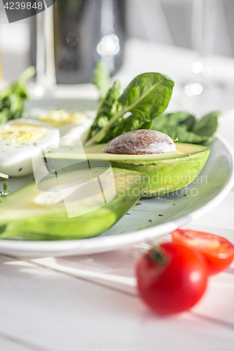 Image of Wine, Tomatoes and greenery wooden background