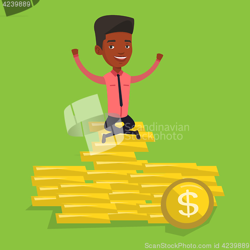 Image of Happy businessman sitting on golden coins.