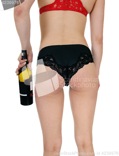 Image of Woman in panties with wine bottle.