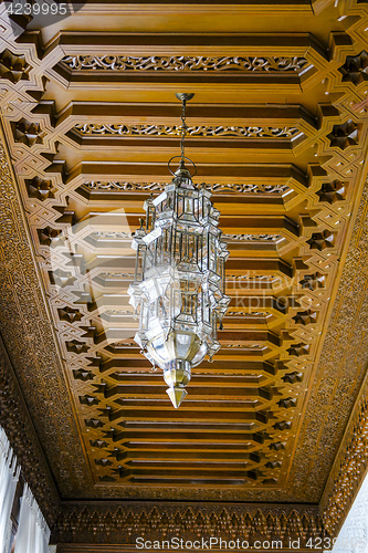Image of Wooden ceilings and arabic lamp, typical of Marrakesh Morocco