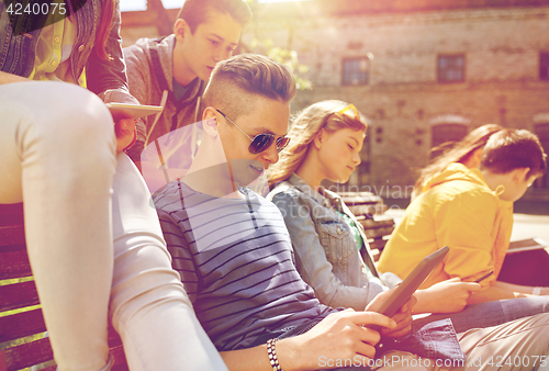 Image of group of students with tablet pc at school yard