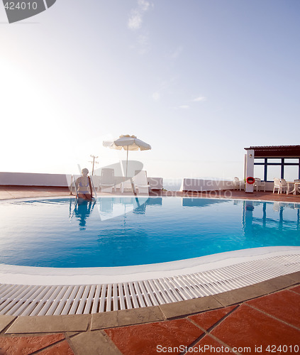 Image of woman in swimming pool greek islands santorini