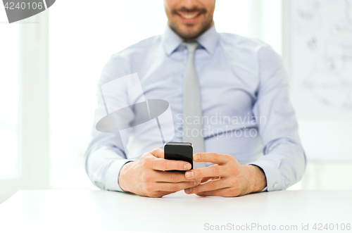 Image of close up of businessman with smartphone