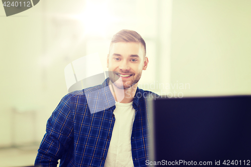 Image of happy creative man or student at office