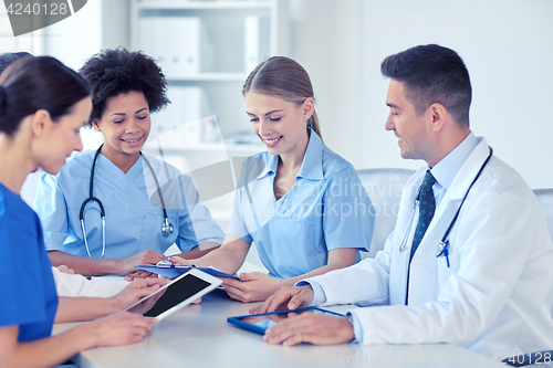 Image of group of happy doctors meeting at hospital office