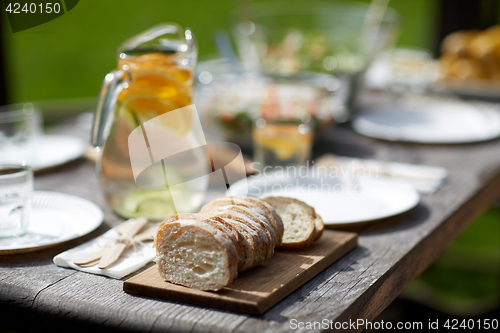 Image of table with food for dinner at summer garden party