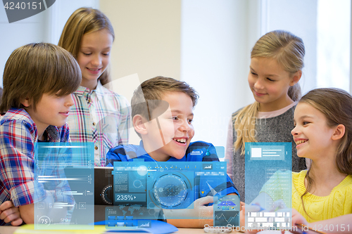 Image of group of school kids with tablet pc in classroom