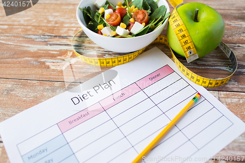 Image of close up of diet plan and food on table