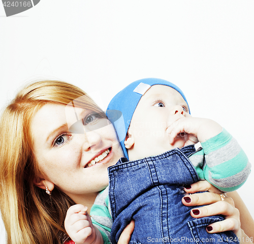 Image of young beauty mother with cute baby, red head happy modern family