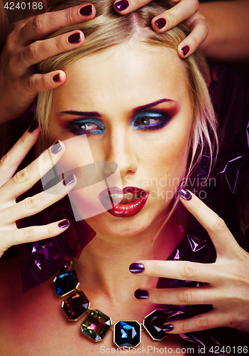 Image of beauty woman with creative make up, many fingers on face close u