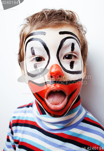 Image of little cute boy with facepaint like clown, pantomimic expression