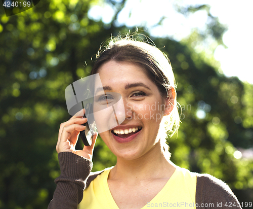 Image of young pretty blonde girl enjoing spring nature in park, lifestyl