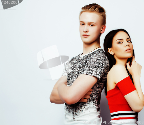 Image of young pretty teenage couple, hipster guy with his girlfriend happy smiling and hugging isolated on white background, lifestyle people concept 