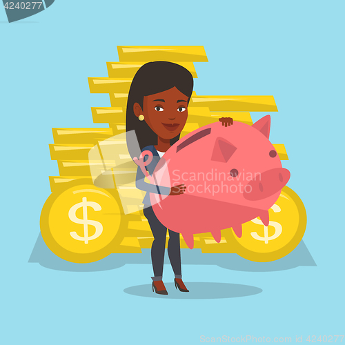 Image of Business woman holding a big piggy bank.