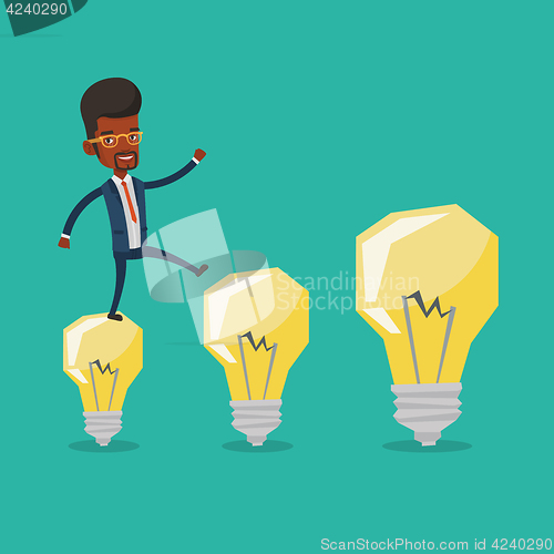 Image of Businessman jumping on idea light bulbs.