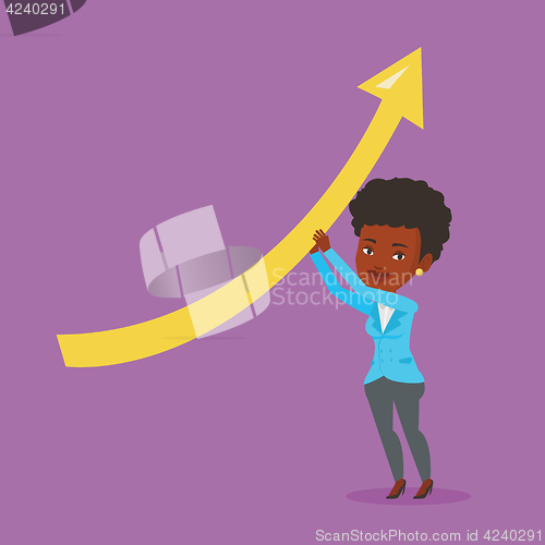 Image of Business woman holding arrow going up.
