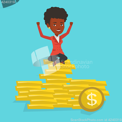 Image of Happy business woman sitting on golden coins.