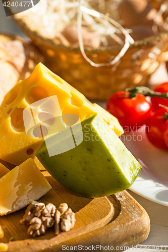 Image of Wine, baguette and cheese on wooden background