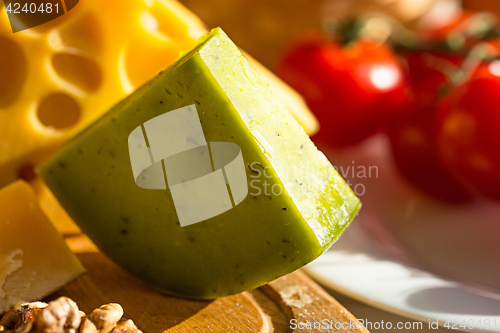 Image of Wine, baguette and cheese on wooden background