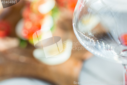 Image of The baguette and cheese on wooden background