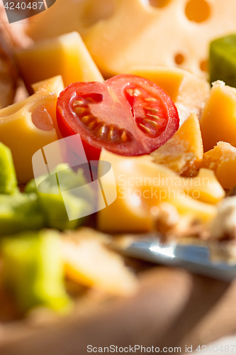 Image of The baguette and cheese on wooden background