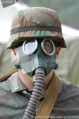 Image of German soldier in gas mask. WW2 reenacting