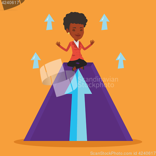 Image of Peaceful business woman meditating in lotus pose.