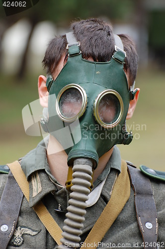 Image of German soldier in gas mask. WW2 reenacting