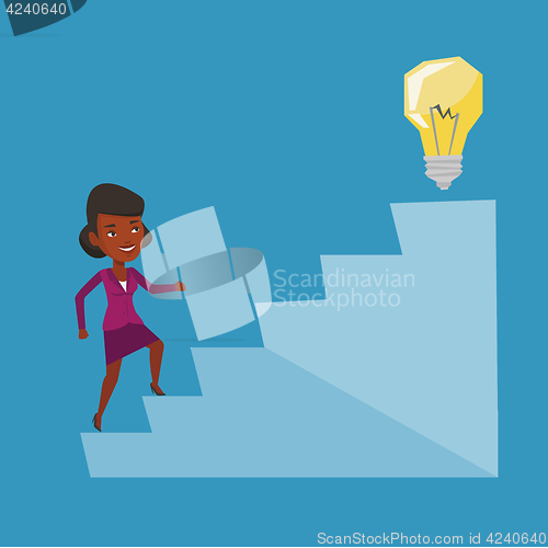 Image of Business woman walking upstairs to the idea bulb.