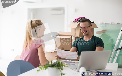 Image of Young couple moving in a new home