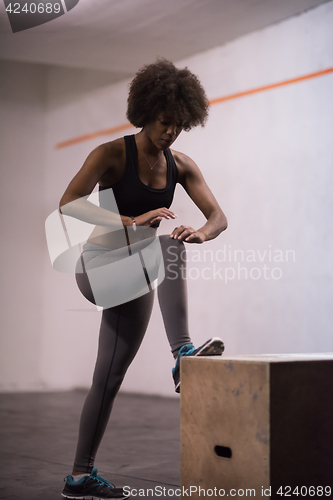 Image of black woman are preparing for box jumps at gym