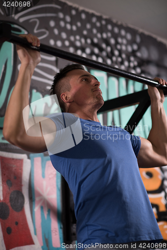 Image of man doing pull ups