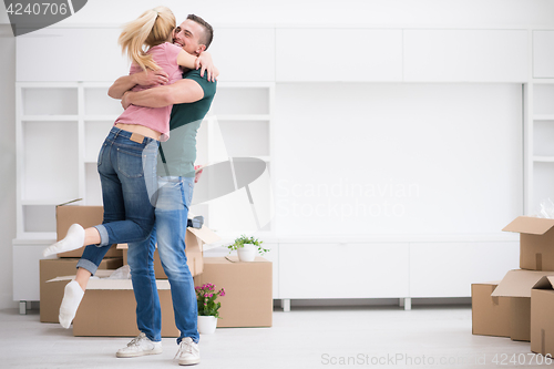 Image of happy Young couple moving in new house