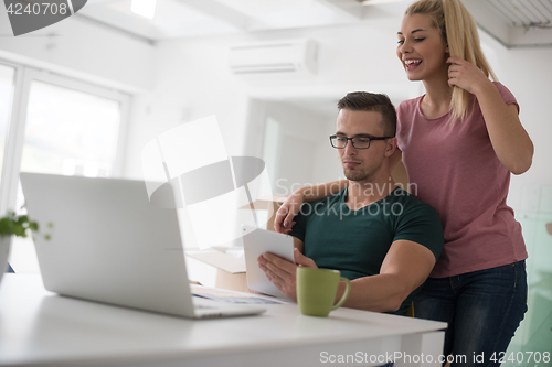 Image of Young couple moving in a new home