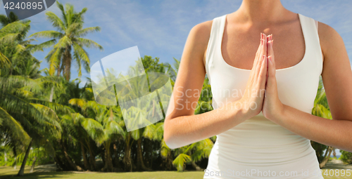 Image of close up of woman doing yoga outdoors