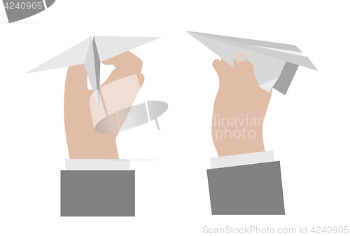 Image of Hand holding a paper airplane.
