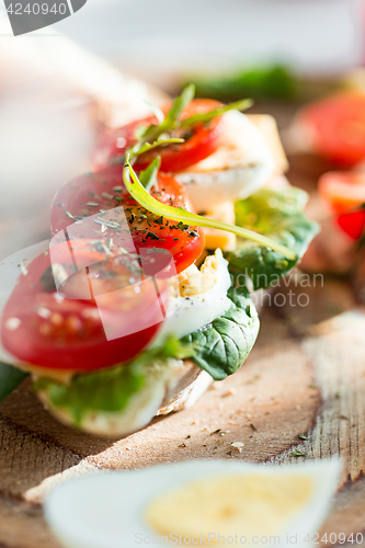 Image of The baguette and cheese on wooden background