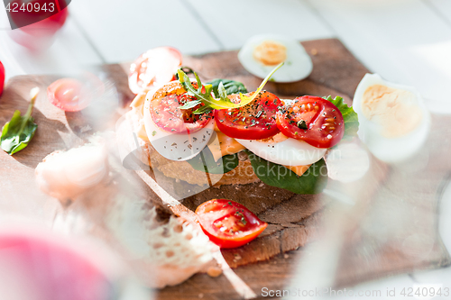 Image of The baguette and cheese on wooden background